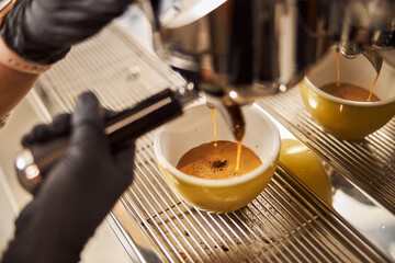 Fototapeta na wymiar Delicious espresso made in cafe by professional barista