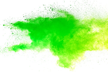 Freeze motion of green color powder exploding on white background.