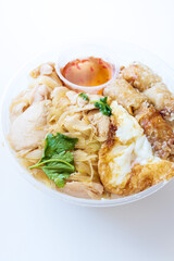 Delicious Vietnamese Bo Bun prepared with rice vermicelli noodles for basics and for topping chicken pieces and fried spring rolls