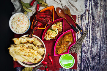 Traditional Indian food chicken tandoori and Tikka with garlic naan