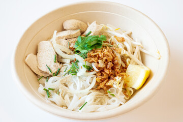 Delicious homemade Vietnamese soup Pho cooked with rice noodles, coriander leaves, soy sprouts, onions and chicken pieces for a complete and healthy meal