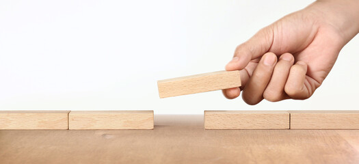 Hand arranging wood block . Business concept growth success