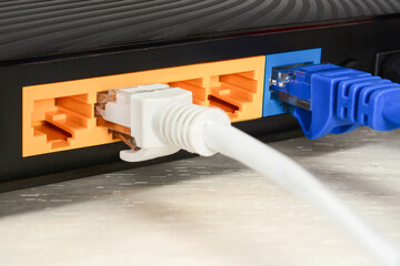 Home wi-fi router for internet connection with patch cords and two connectors. Concept home...