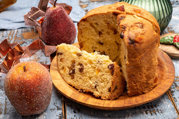 Christmas food, fresh Italian panettone cake made from yeast dough with dried fruits
