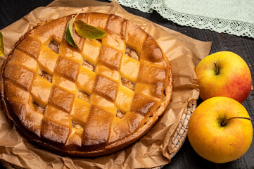 Fresh baked apple cake or pie, filled with sweet apples, raisins and cinnamon