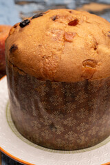 Christmas food, fresh Italian panettone cake made from yeast dough with dried fruits