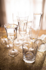 Several champagne glasses over gold christmas background. Celebrating new year concept.