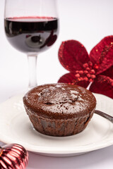 Popular british christmas food, glass of vintage ruby port wine and hot chocolate cake with christmas tree decoration on background