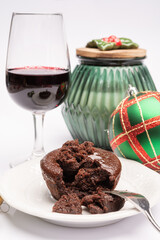 Popular british christmas food, glass of vintage ruby port wine and hot chocolate cake with christmas tree decoration on background