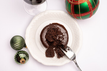 Popular british christmas food, glass of vintage ruby port wine and hot chocolate cake with christmas tree decoration on background