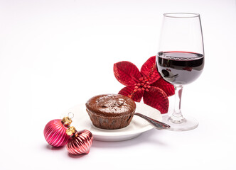 Popular british christmas food, glass of vintage ruby port wine and hot chocolate cake with christmas tree decoration on background