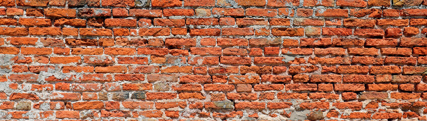 Ancient wall of many red bricks