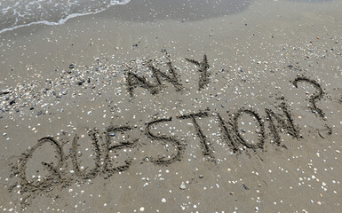 Big text ANY QUESTION on the beach