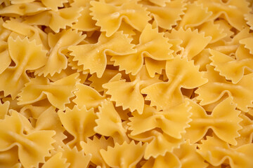 some farfalle pasta forming a background pattern