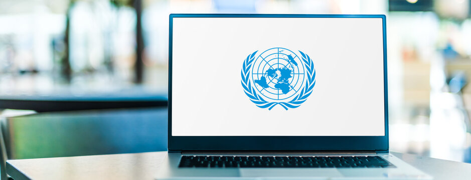 Laptop computer displaying logo of The United Nations (UN)
