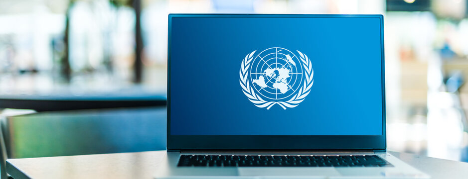 Laptop computer displaying logo of The United Nations (UN)