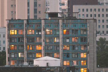 Sunset in the windows of an old hostel