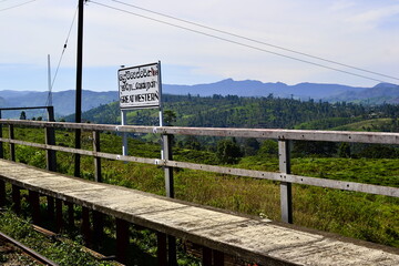 Great Western railway hill station on the mountain railroad in Sri Lanka. Old wrathered platform on a background of hills woth tea plantations.