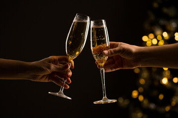 New Year concept, woman and man with champagne glasses clinking