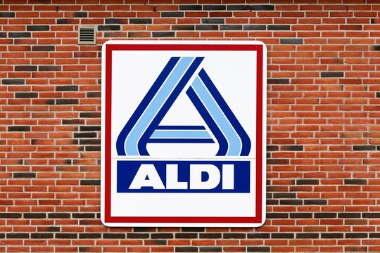 Hjorring, Denmark - June 28, 2015: Aldi logo on a wall. Aldi is a leading global discount supermarket chain with over 10 000 stores in 18 countries
