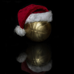 Basketball ball with a Santa hat on his head