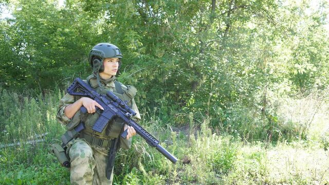 Military woman has hobby activity, practice lends success hunting, female has hunting experience in nature environment. Hunting weapon gun or rifle, hunting target concept.