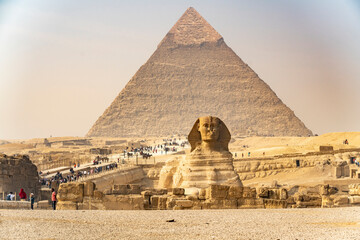 Tourists visit the pyramids and sphinx in Giza, Egypt