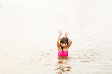 Little Girl Swimming In The Sea