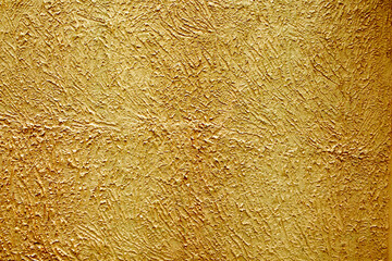 Golden cement wall for design and texture background.