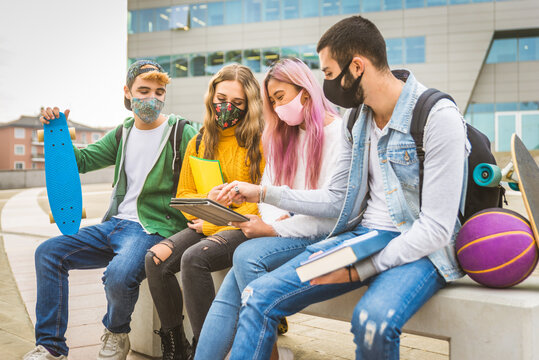 Group of young students bonding outdoors