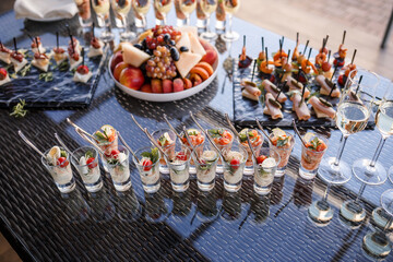 Buffet table for guests at a banquet with various snacks and sandwiches