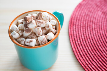 Cup of hot chocolate with marshmallows on the table