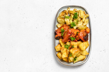 Oven baked various colorful vegetables. Top view, space for text.