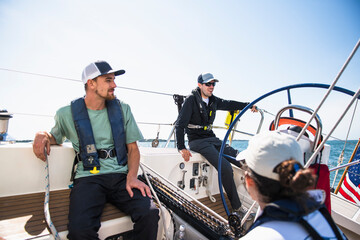 Family sailing on a sunny summer day