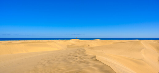 Sand Dunes in Gran Canaria with beautiful coast and beach at Maspalomas, Canarian Islands, Spain