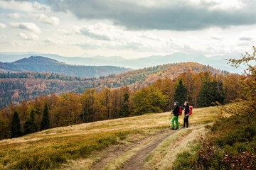 Fototapeta na wymiar Men trekking in autumn Beskidy