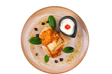 Chicken pie with white and red sauce, isolated white background.