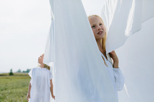 children in the village play hide and seek among the washed white line
