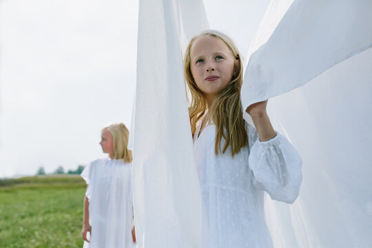 children in the village play hide and seek among the washed white line