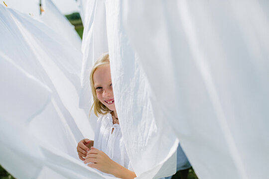 Little village girls playing hide and seek