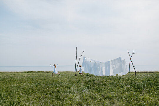 in summer children play catch-up in the field