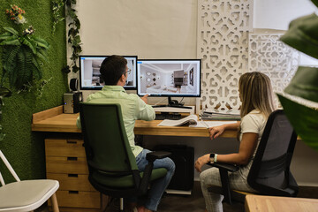 colleagues review their new project on the computer