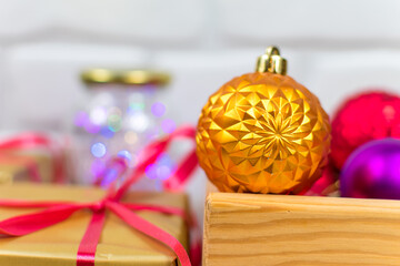 Christmas background with multicolored Christmas balls and blurred background. New Year card.