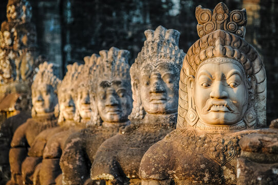 Angkor Archaeological Park, Siem Reap, Cambodia. Close up of ancient carved faces on south gate of Angkor Thom.