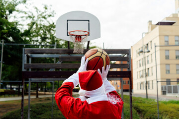 Santa Claus throwing a triple with his basketball