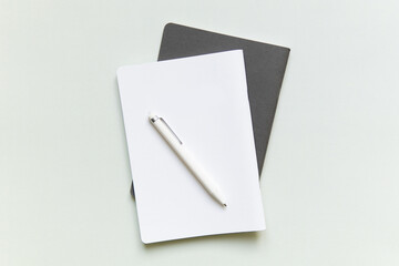 white lies notebook the gray notebook in the form on a white background with white handle closeup