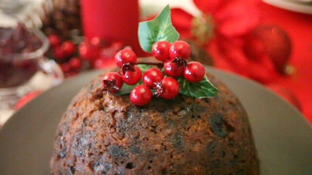 Spinning Christmas pudding with holly on top