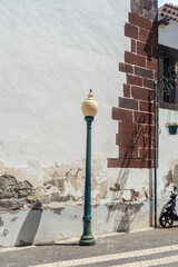 city lamp near wall