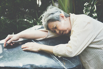 stressed depressed fatigued sad upset asian old asian elderly senior elder woman