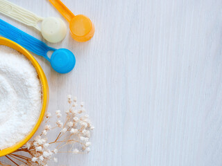 Baby food in a yellow bowl. Mixing technology for children.